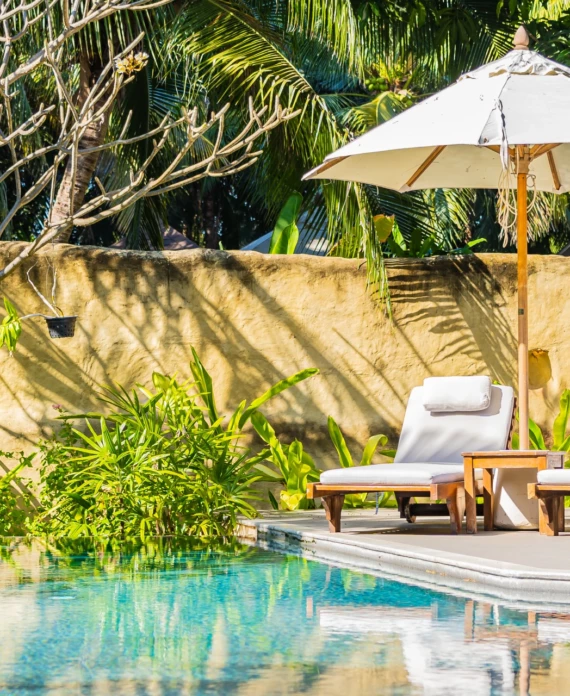 umbrella-chair-around-outdoor-swimming-pool-resort-hotel-vacation-leisure 1